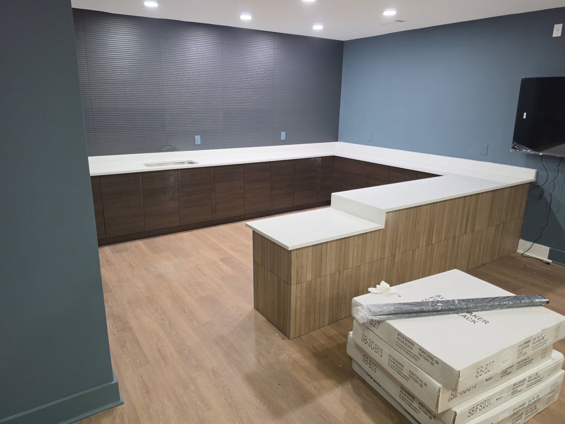 White quartz U-shaped bar counter in a commercial space